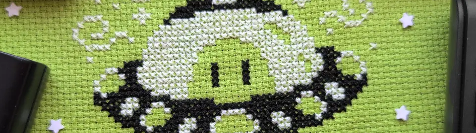 A cropped horizontal banner of the pattern An Unlikely Fan.